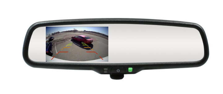 Car dashboard with a clip-on reverse camera showing a live feed of the vehicle's rear area.